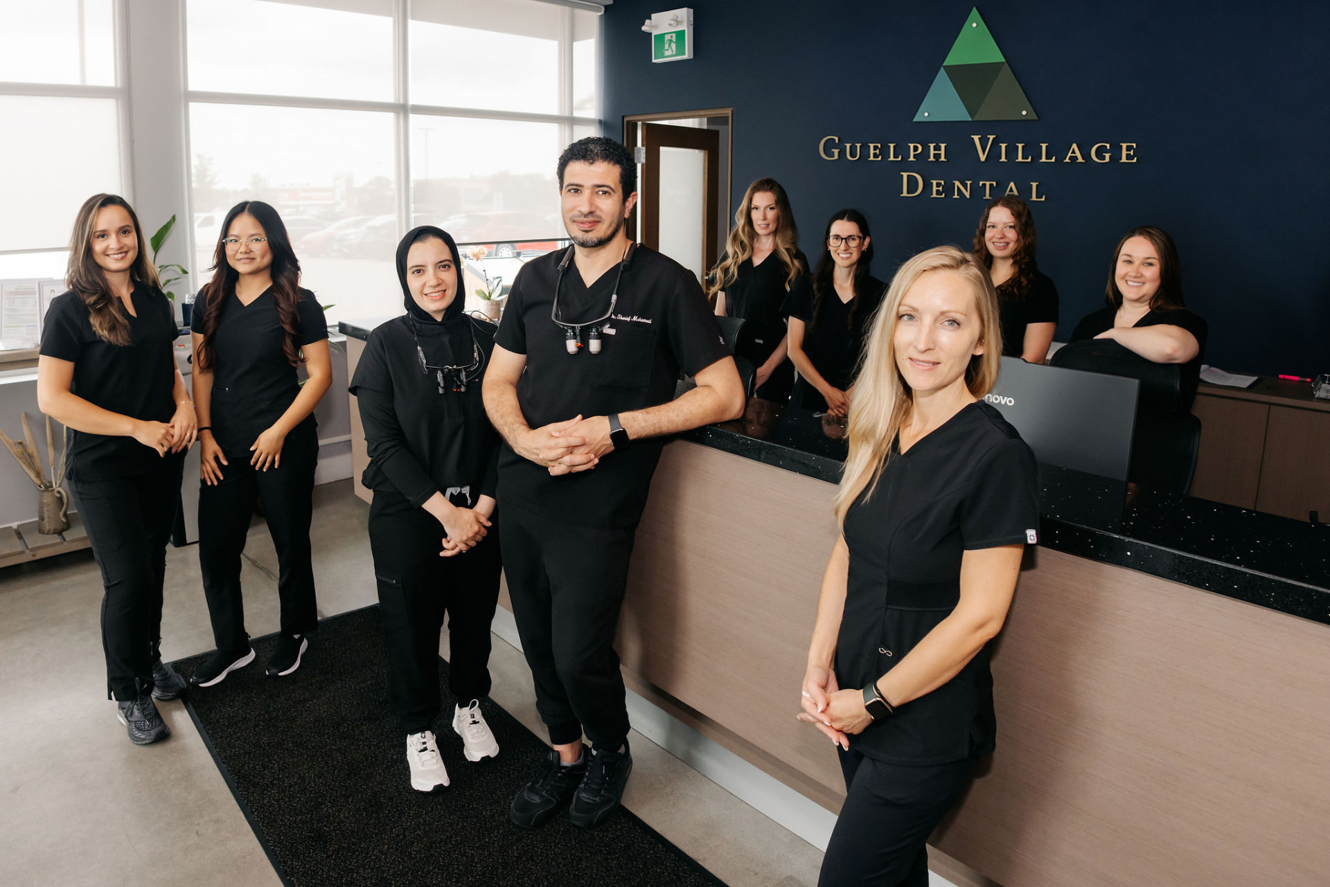 The Guelph Village Dental team at the clinic reception desk